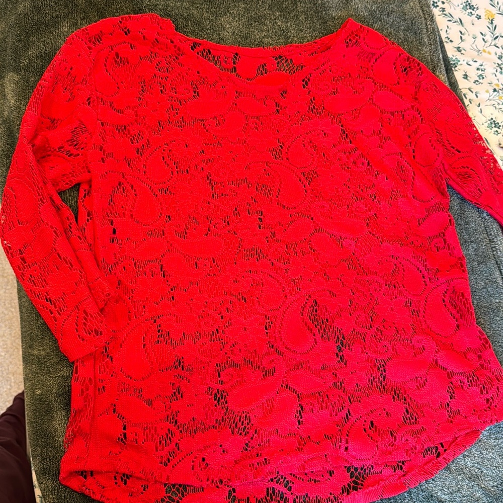 Bright red net / lace top. Pair it with jeans or trousers. Get an elegant look